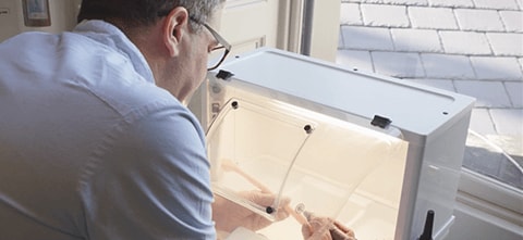 a man working on a 3d printed dental model