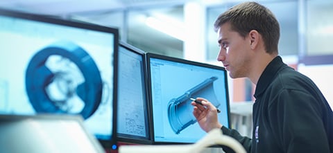 Guy reviewing CAD file to 3D Print