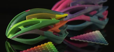 colorful 3D printed helmets created by the Stratasys Connex3 printer