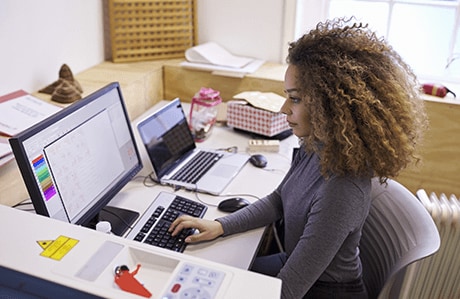 a person working on a computer screen using 3D printing software